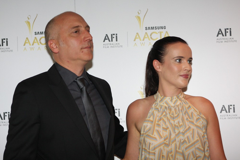 MacKenzie Scott and a man attending the AACTA Awards ceremony on the red carpet.